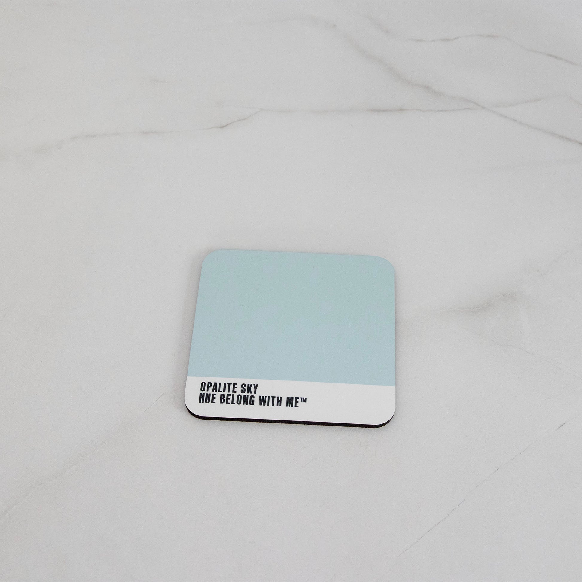 Soft sky-blue cork-back coaster, flat lay mockup — Opalite Sky by Hue Belong With Me