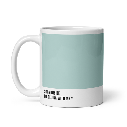 Soft sky-blue ceramic mug, handle left, showing Storm Inside label — Opalite Sky by Hue Belong With Me