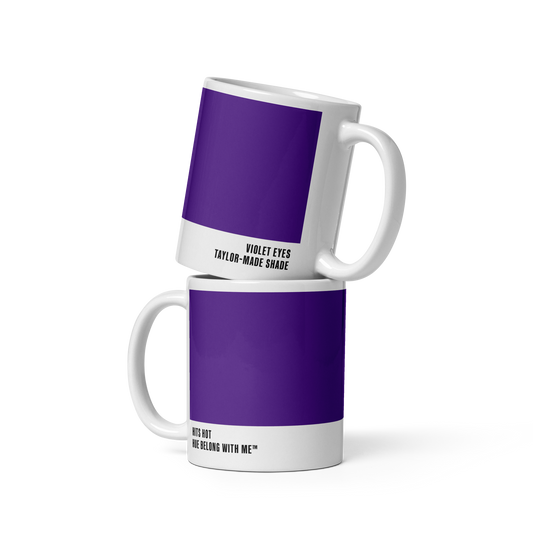 Deep commanding purple ceramic mug in stacked two-mug mockup showing both labels — Violet Eyes by Hue Belong With Me