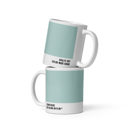 Soft sky-blue ceramic mug in stacked two-mug mockup showing both labels — Opalite Sky by Hue Belong With Me