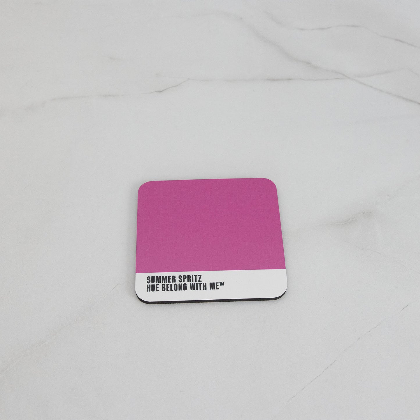 Vibrant magenta cork-back coaster, flat lay on marble counter — Summer Spritz by Hue Belong With Me