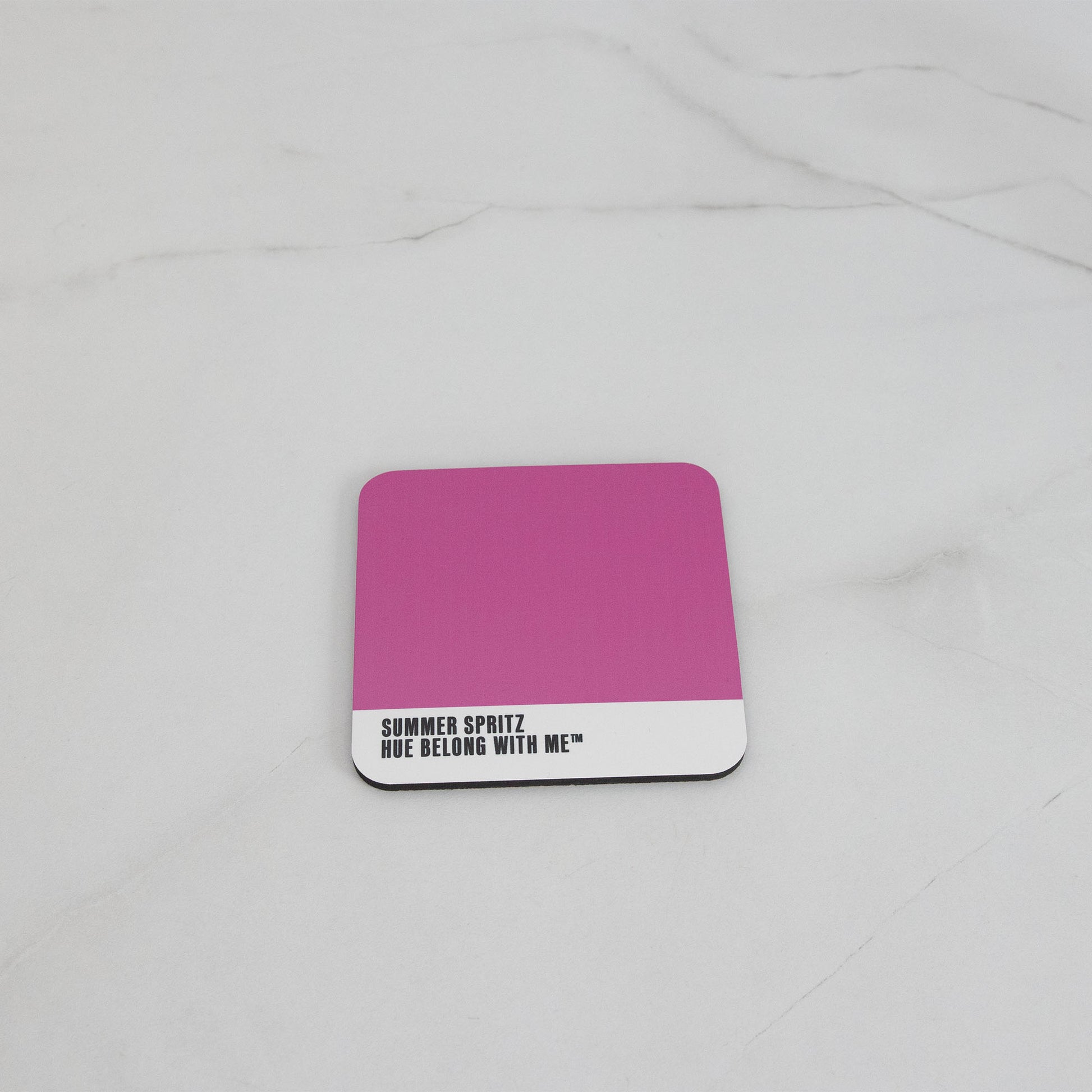 Vibrant magenta cork-back coaster, flat lay on marble counter — Summer Spritz by Hue Belong With Me